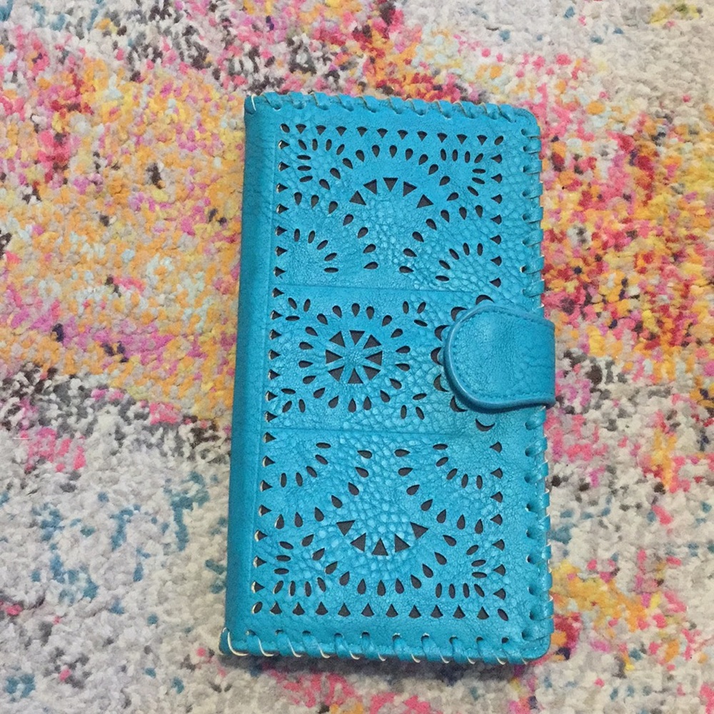 NWOT Turquoise wallet with laser cutout detail